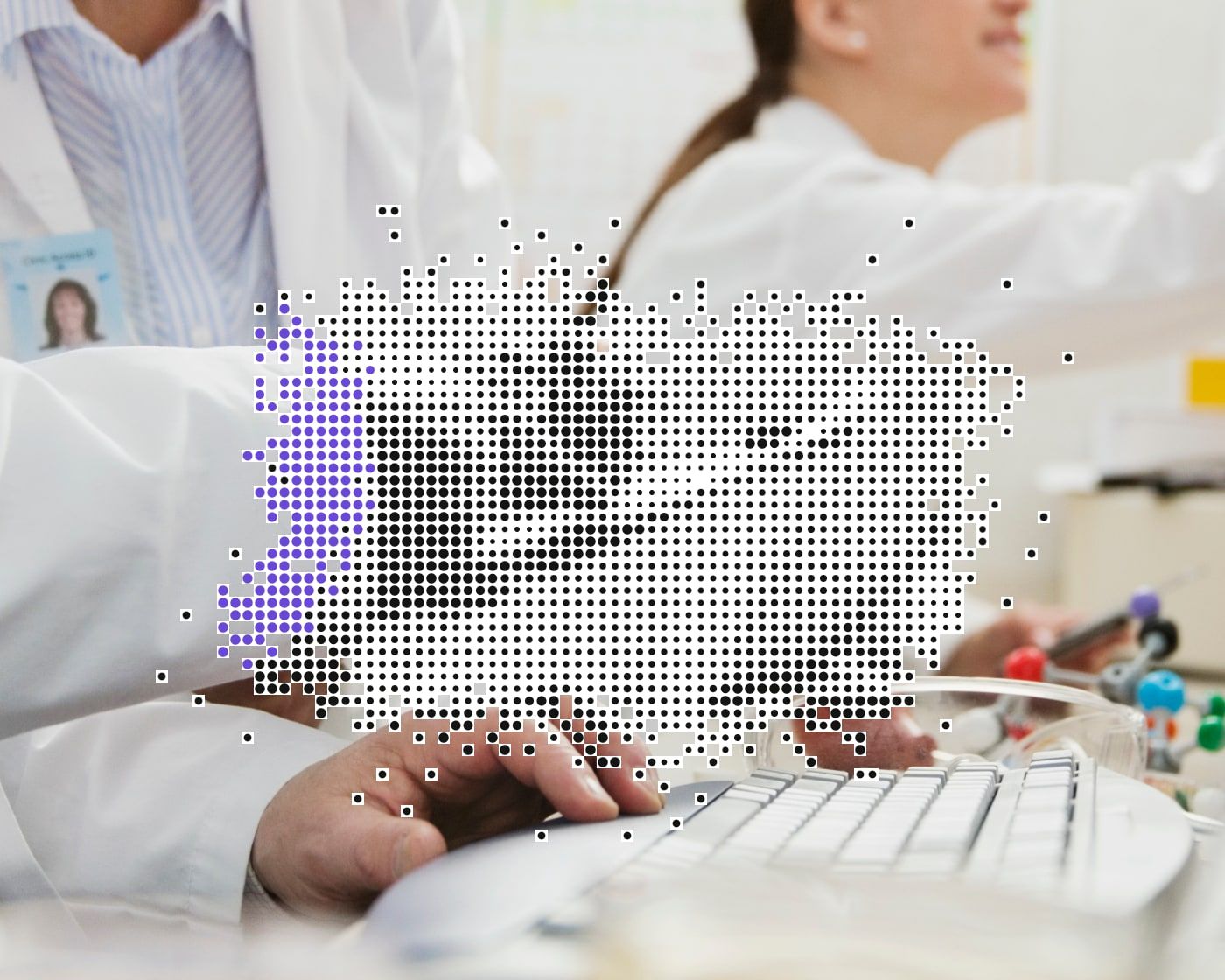 Lab scientists at a computer keyboard, overlaid with a black, white, and purple dot-matrix pattern